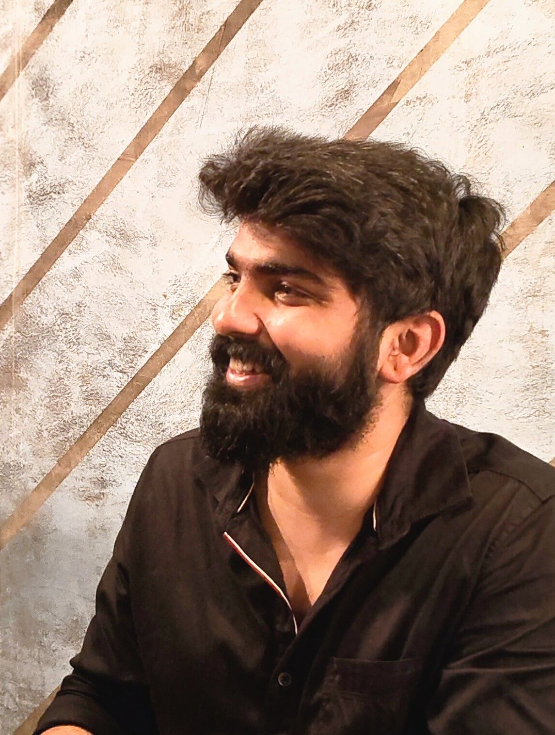Prathamesh Patil, smiling, in a black shirt